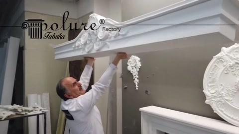 The craftsman positions a wide upper cornice profile over the decorative pediment