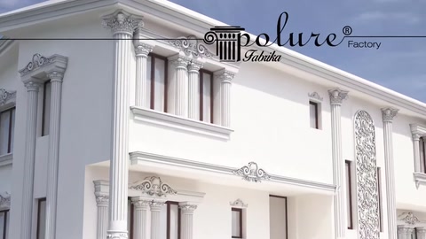 Window surrounds and horizontal mouldings are visible on the white building facade