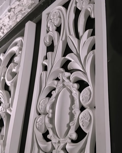 A carved laser-cut decorative panel is shown in close-up