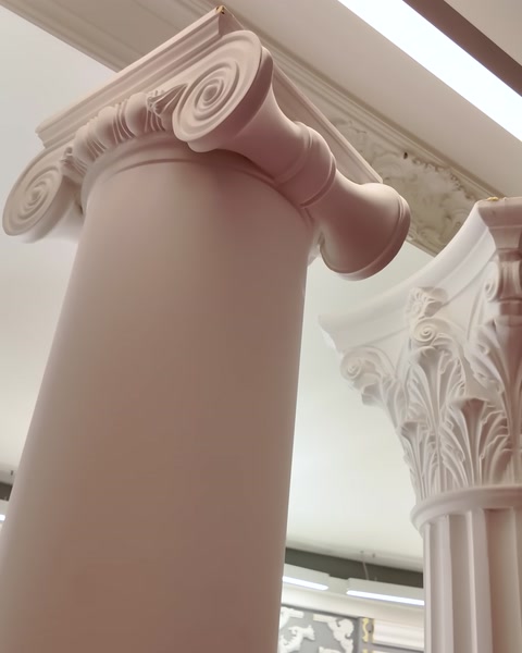 A close-up shows the embossed capital detail of a column
