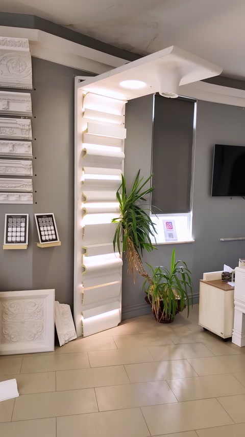 A showroom display wall framed by illuminated profile examples