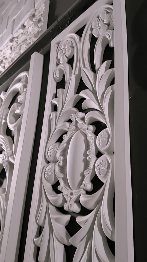 Decorative panel details adorned with leaf scrolls and medallions