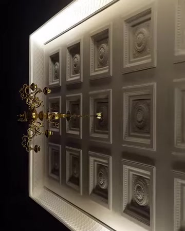 The symmetrical placement of square domes and the surrounding cornice details