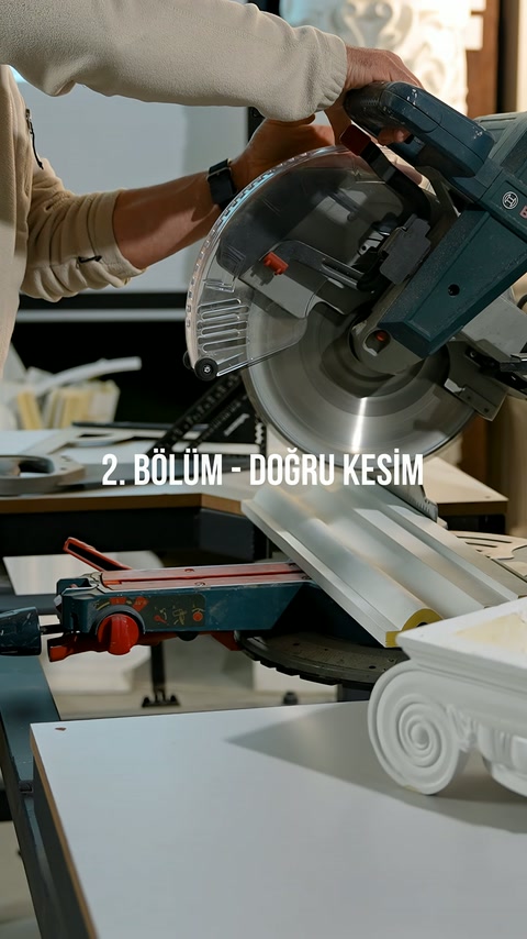 Gloved craftsman lowers the machine arm toward the profile