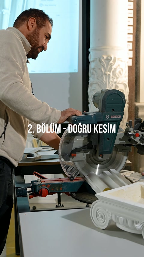 Cutting operation continues with the rotating saw while the profile is held on the bench