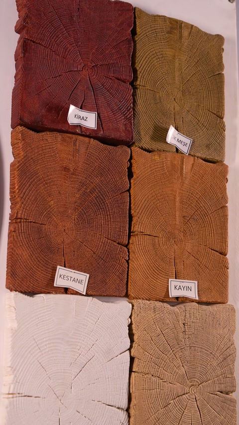 Labeled faux timber cross-section samples display varied grain colors and textures