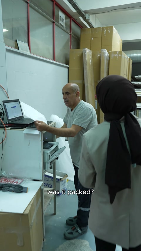The production team reviews the project details in the work order together