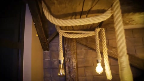 Decorative beam application with rope details on a rustic ceiling