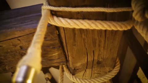 Wood texture and decorative rope connection detail on a decorative beam