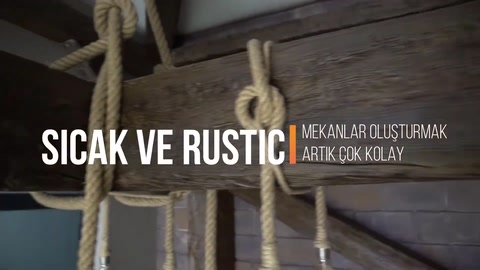 Rustic interior completed with ceiling beams and rope details