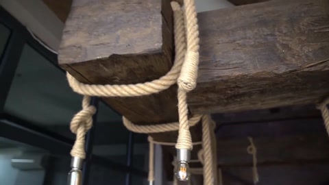 Combination of wood texture and decorative rope on a beam surface