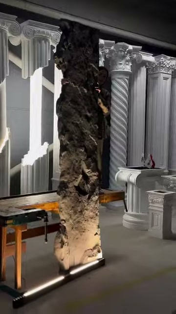 A rock-look decorative panel is presented from the front in a display area