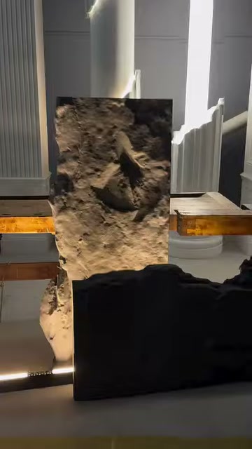 The dark piece in front of the rock-look panel is moved downward