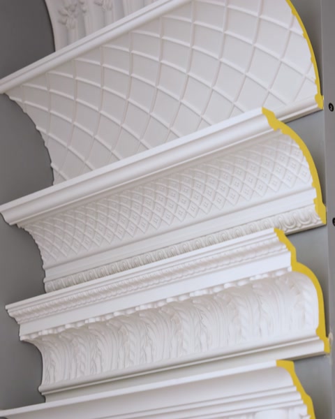 Quilted pattern cornice molding profile shown in stacked showroom display