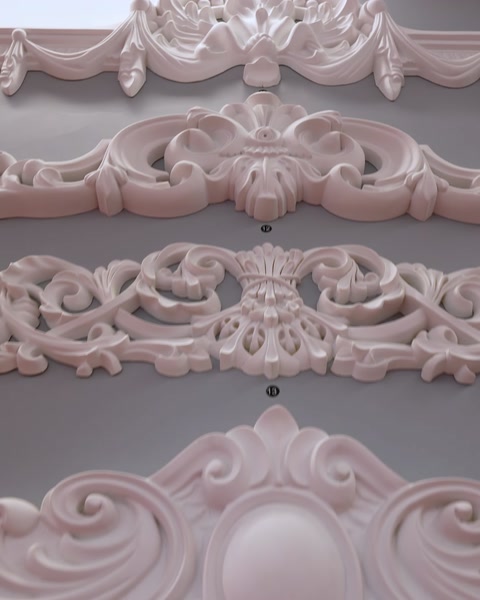 Ornate decorative wall panel with scroll and floral relief pattern