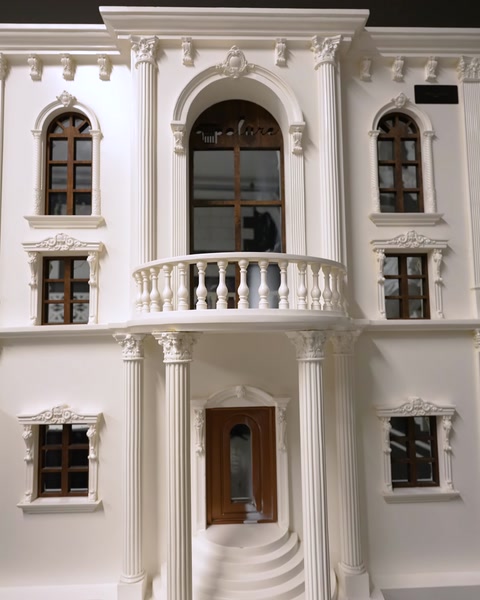 Building facade model with columns, balcony, and window surrounds