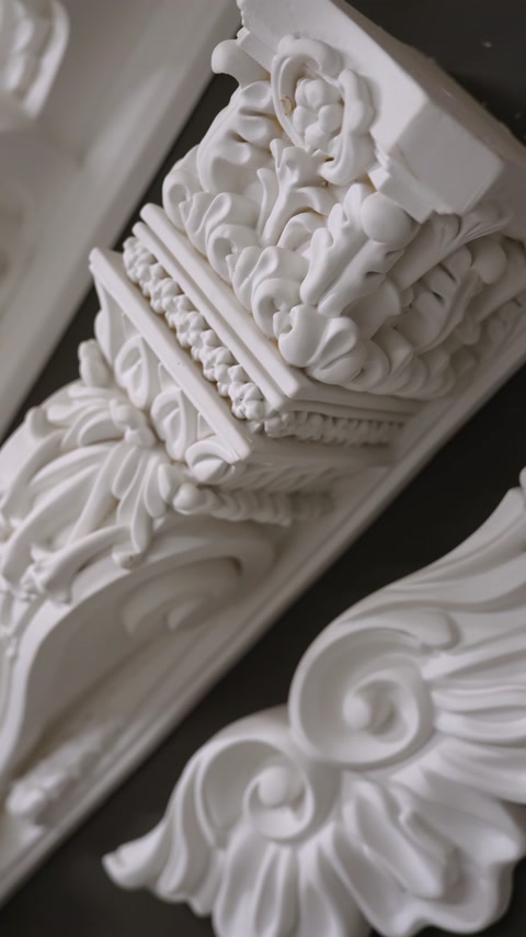 Ornate corbel and cornice corner detail with floral relief carving
