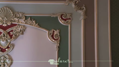 Corner motif with gold accents shown with white and green wall surfaces
