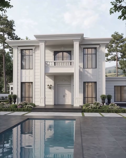 White villa facade with a pool, entrance columns and balcony