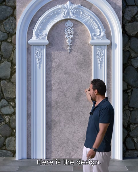 The finished arched doorway frame design is mounted on the wall