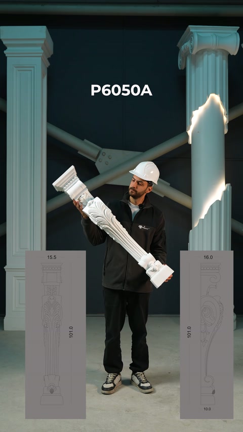 This video shows a worker displaying a long embossed architectural element between vertical columns.