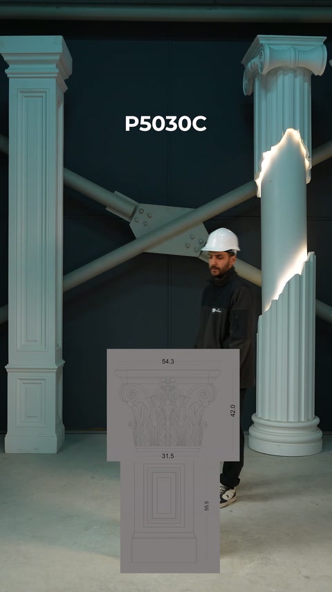 This video shows a dimensioned draft of a column capital centered as a craftsman approaches.
