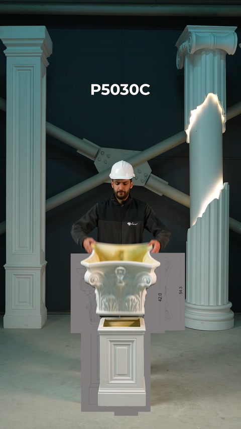 This video shows a craftsman preparing to place a decorative column capital on a pedestal.