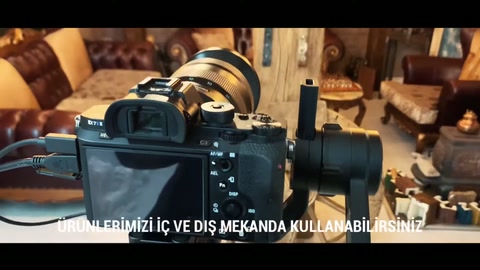 During workshop filming, beams behind decorative wheels are captured.