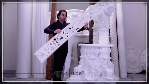 A long polyurethane piece with a perforated ornamental pattern is presented
