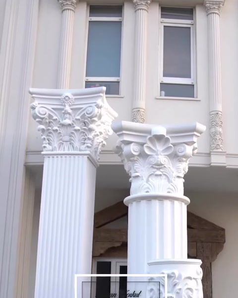 Close-up of capital ornamentation atop finished column.