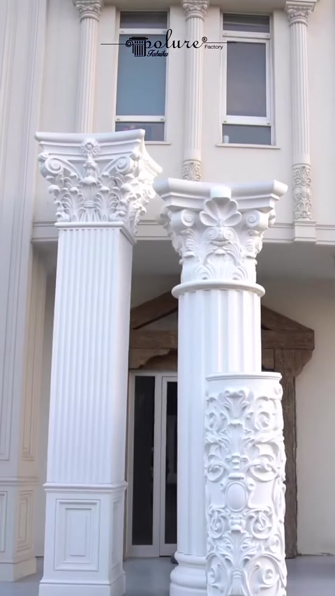Two finished fluted columns with Corinthian capitals on facade.