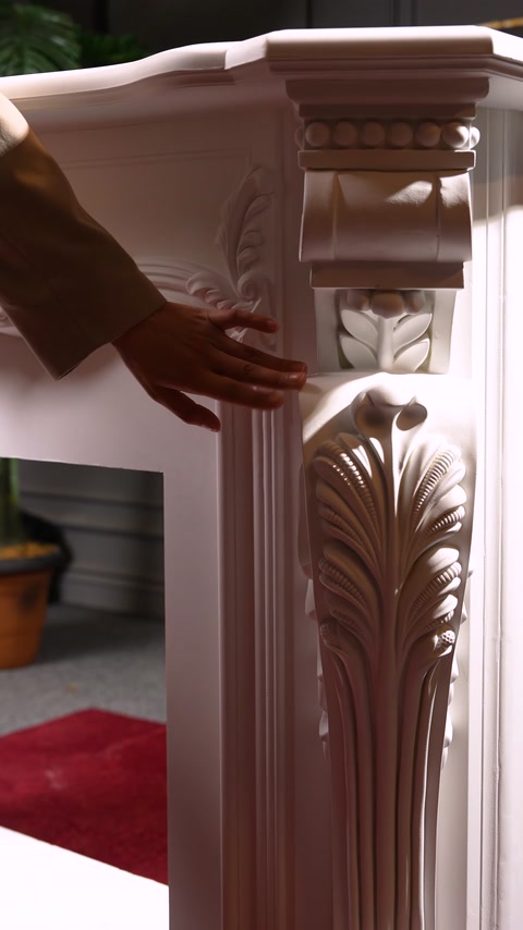 Ornamental bracket and border details beside the fireplace