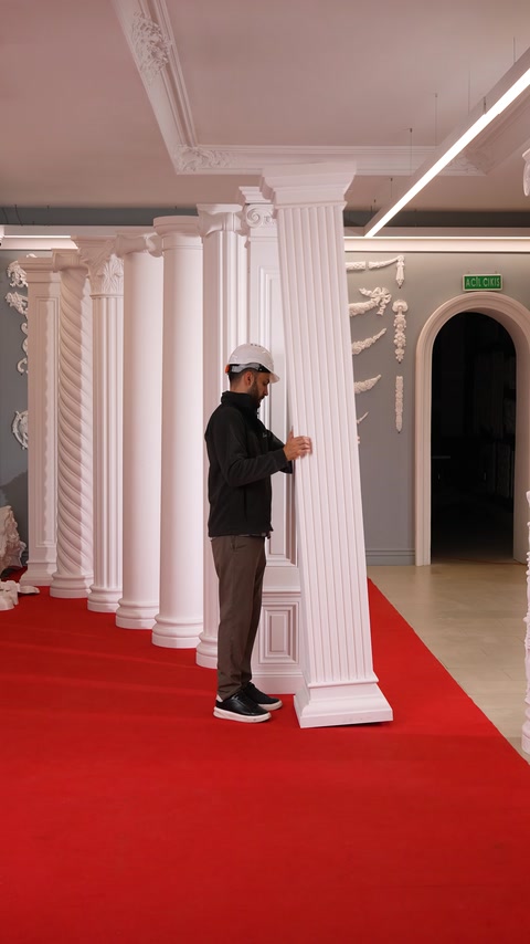 Craftsman positions a fluted column near arched doorway entrances.