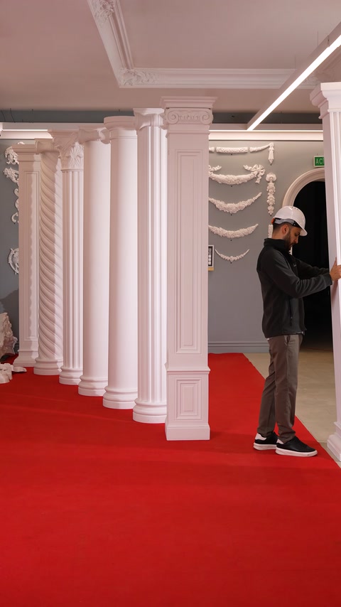 Columned hallway showcases multiple polyurethane column styles side by side.