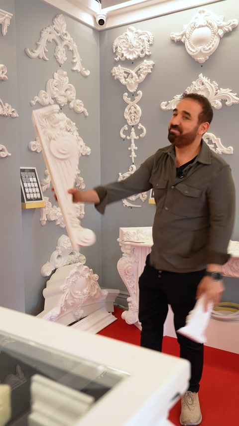 Server grasps a wide-based baluster model with both hands