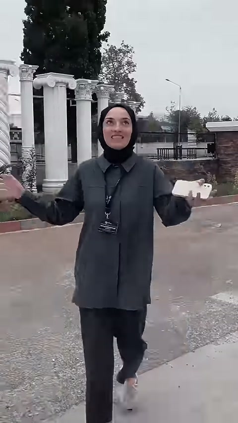 The presenter introduces classical capitaled columns in the outdoor display.