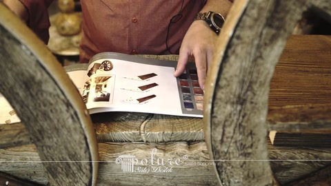 Wood-look polyurethane product samples examined in a catalog