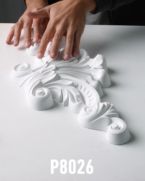 Wide view of acanthus scroll polyurethane wall ornament with hands