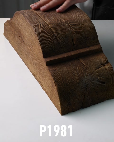 Top view of wood-textured polyurethane corbel bracket on table