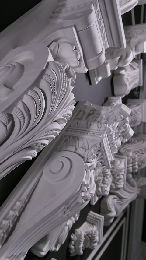 Close view of layered floral scrolls and carved decorative profiles