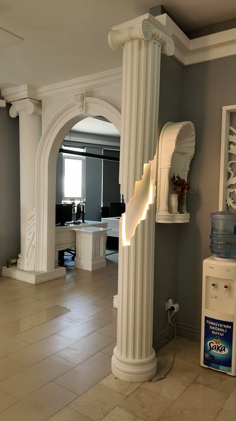 Classical arched surround paired with tall fluted decorative columns
