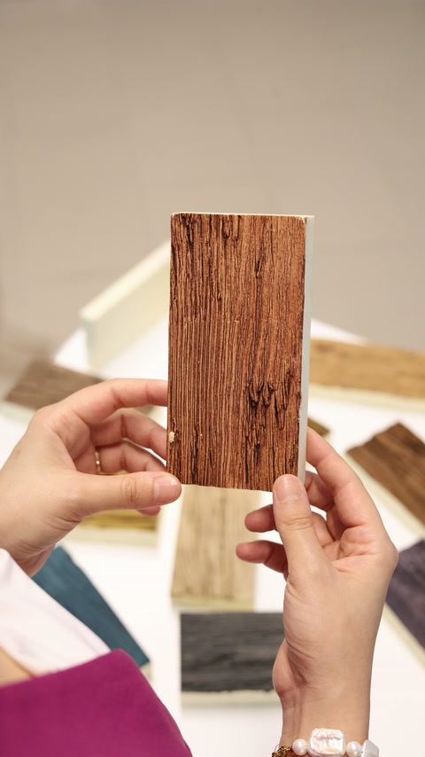Wood-effect rectangular finish sample held above additional color options