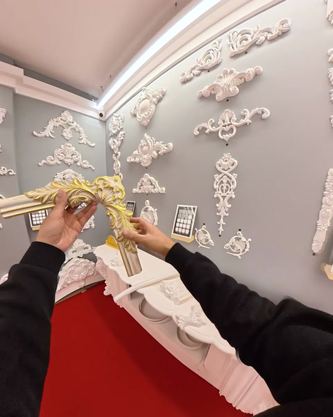 Wall display of assorted polyurethane relief panels and appliques