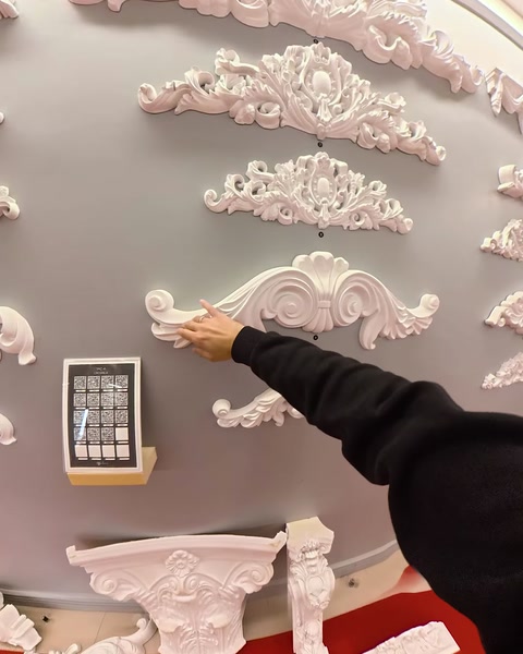 Hand mounting a decorative applique onto showroom wall panel