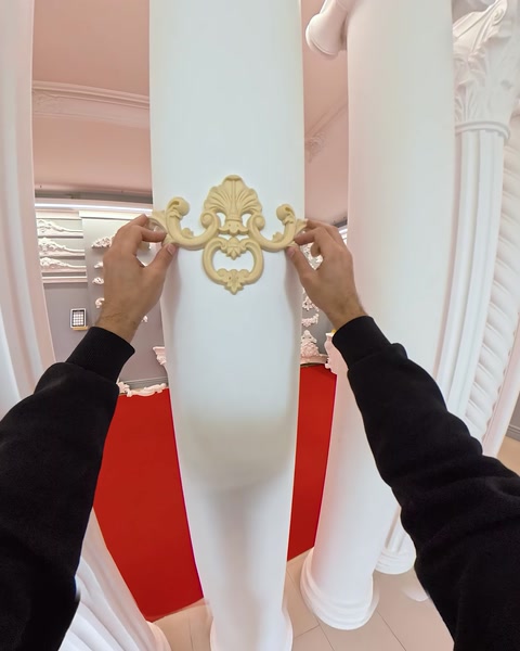 Applying gold decorative applique onto a column shaft