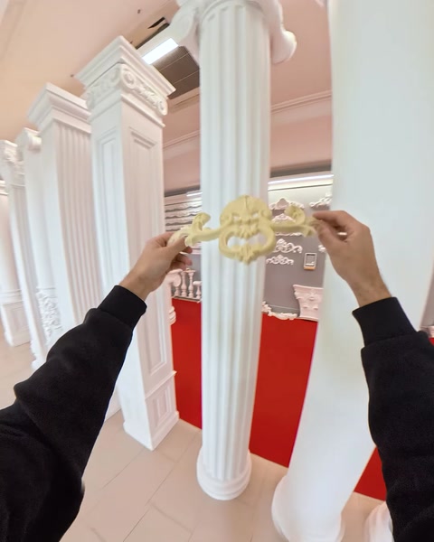 Row of tall fluted columns with ornate capitals