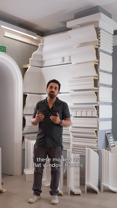 Presenter introducing models in the product area displaying various cornice profiles