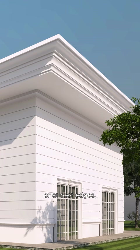Multi-layered mouldings continuing beneath the eaves at the corner of a building