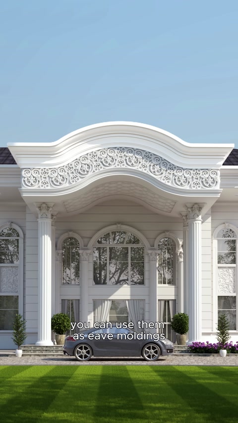 Curved eaves moulding and an ornamental pediment on a columned entrance facade