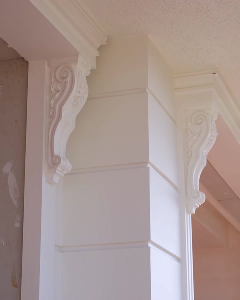 Close-up of polyurethane cladding with carved details on a column capital